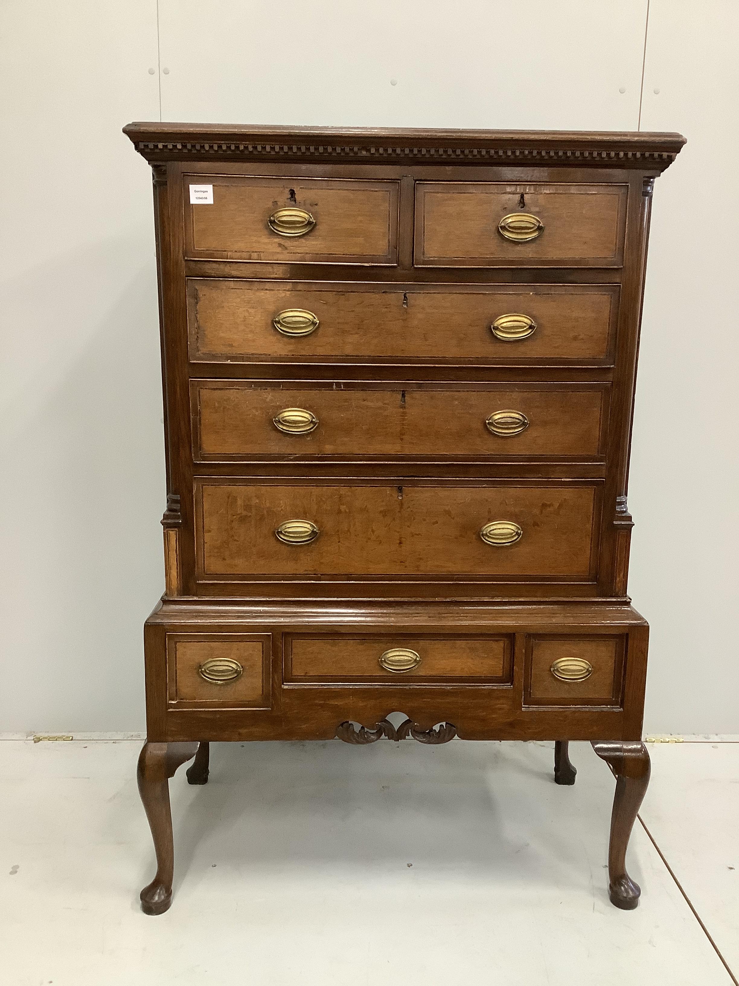 A George III mahogany banded oak chest on stand, width 97cm, depth 51cm, height 152cm